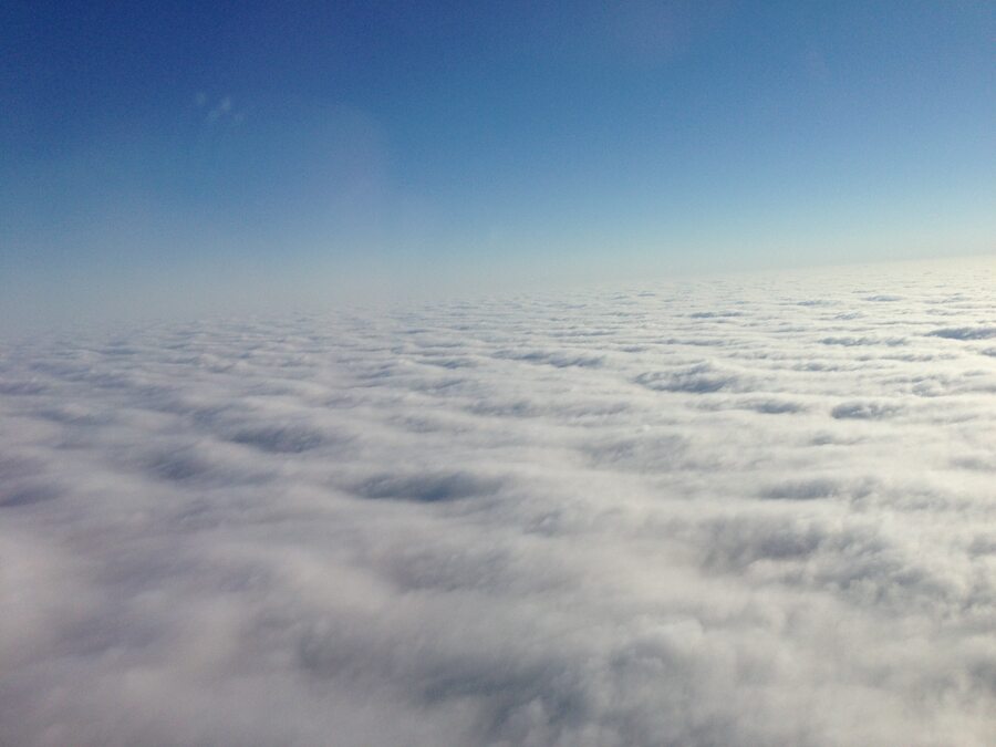 Commercial aircraft above the clouds